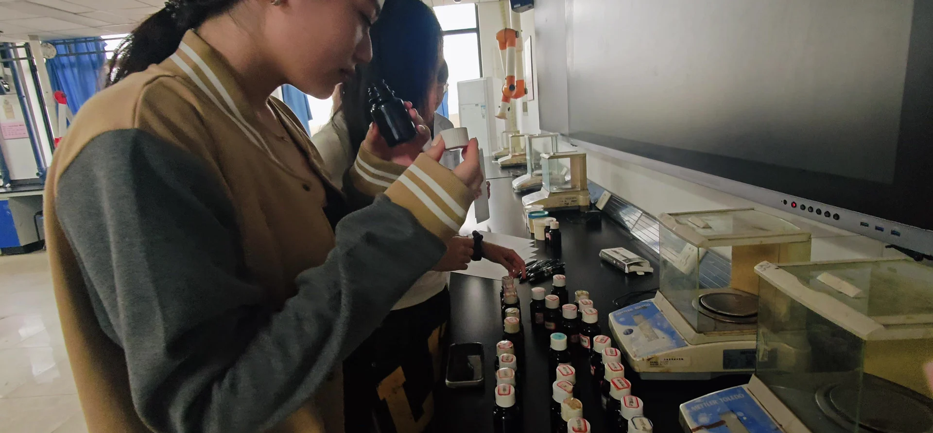 MCA students comparing fragrance materials in the laboratory